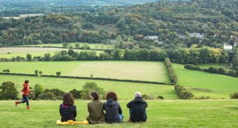 Photo of a family looking over the Surrey Countryside