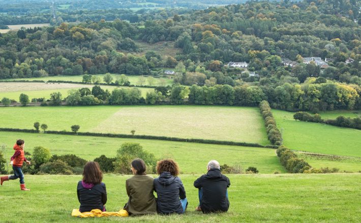 Photo of a family looking over the Surrey Countryside