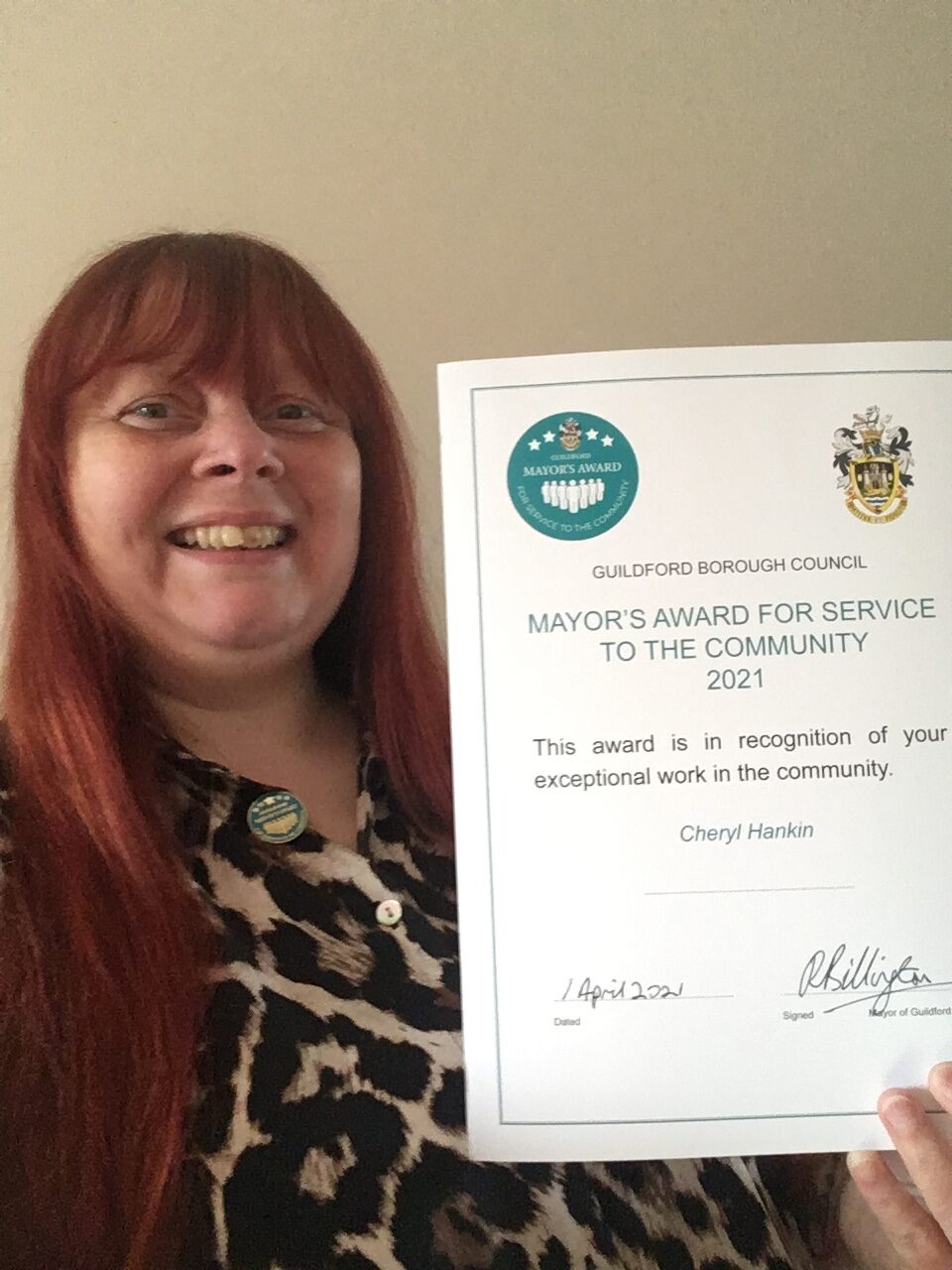Image of Cheryl Hankin, who runs CTK Recycling, with the certificate for the Major's Award for service to the community which she received in 2021